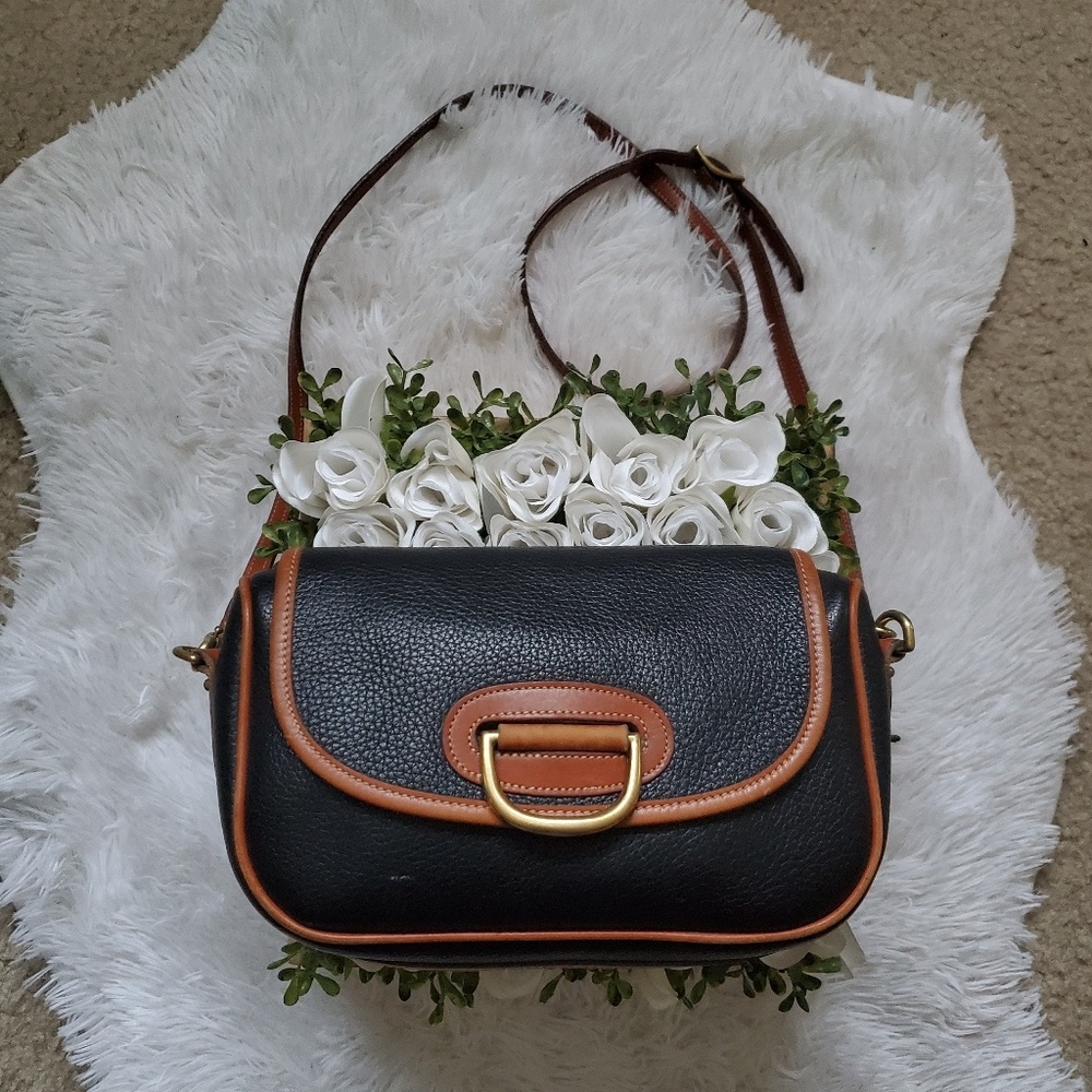 Dooney & Bourke All Weather Leather ®
Porthole Bag